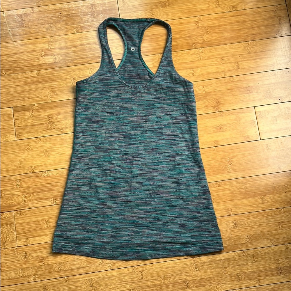 Women’s Lululemon double sided symbol tank top. Medium multicolor